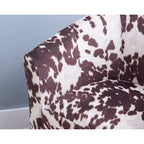 Fauteuil club Andrew Barrel imprimé vache marron et blanc